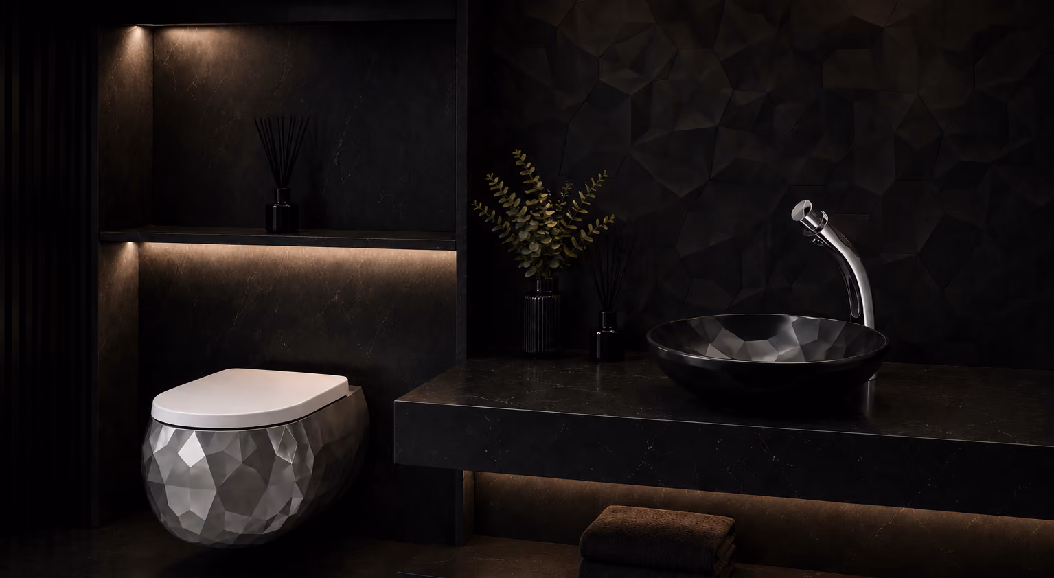 Dark bathroom with Pent faceted wall-hung water closet and black faceted countertop basin
