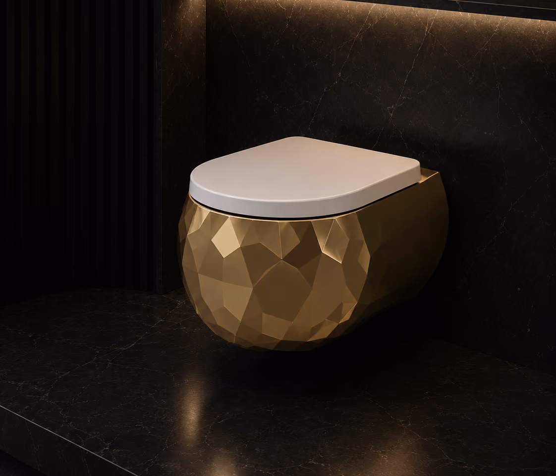 Pent wall-hung water closet in faceted gold with white seat against dark marble