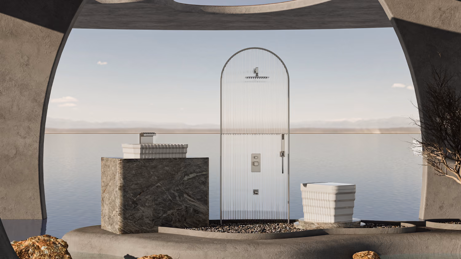 Open-air arched rain shower column and stone washstand set against a calm lake horizon